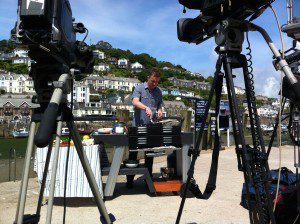 James Tanner preparing to cook Looe harbour-side