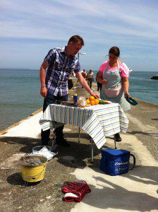 James Tanner preparing to cook on the pier at Looe