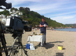 James Tanner preparing to cook on the beach at Looe